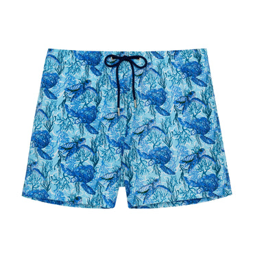 Blue swim shorts with turtle pattern on a white background